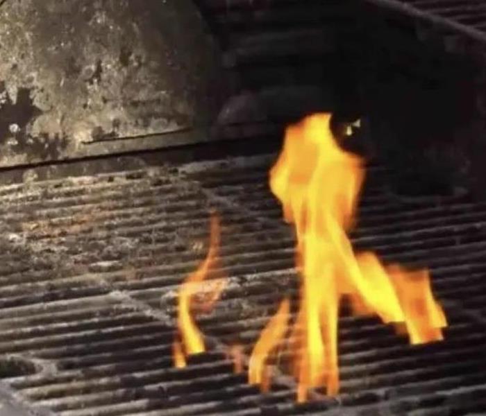 grill plates with flames coming out